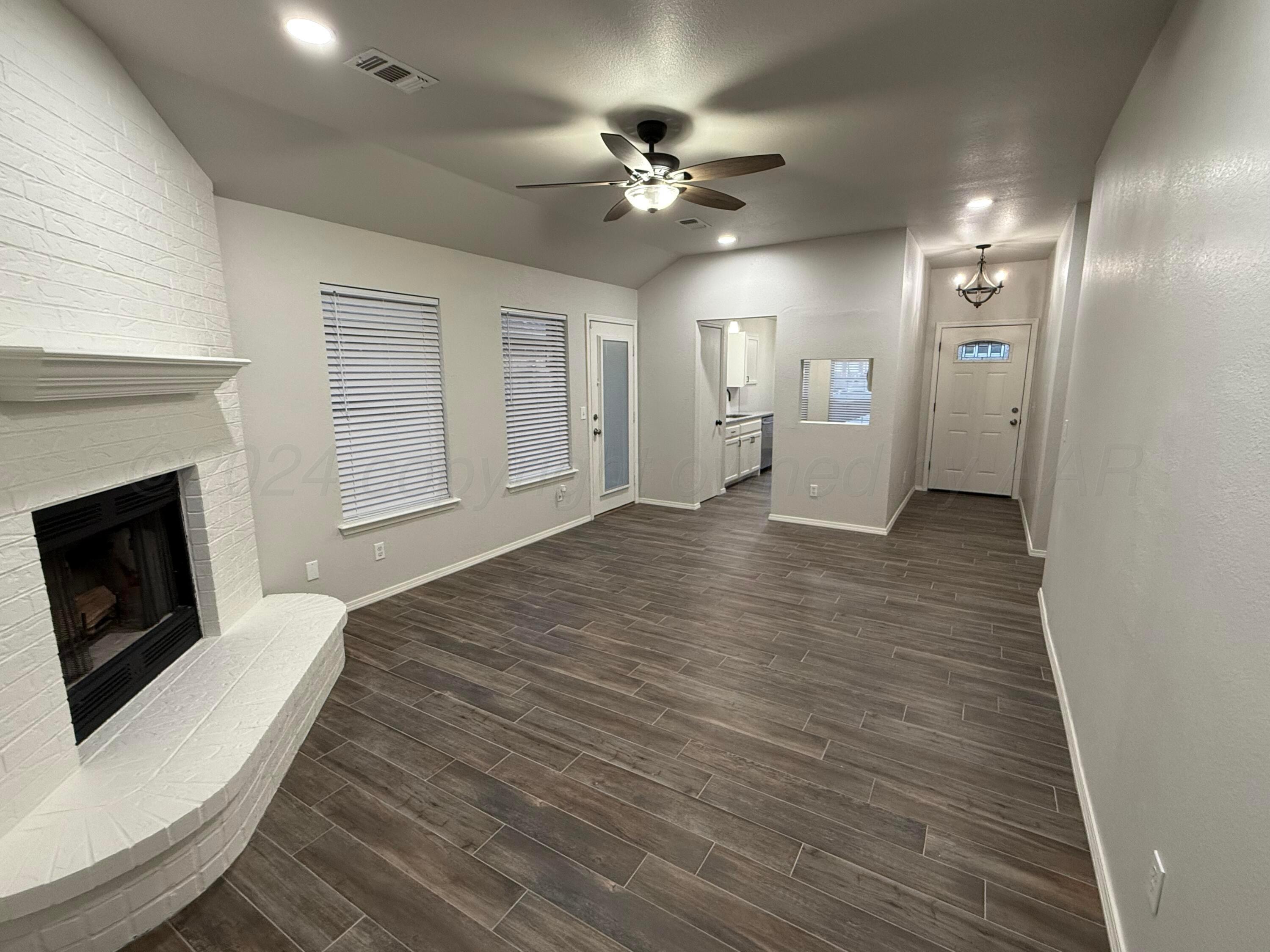 4914 Capulin Lane Amarillo, TX 79110 - Photo 3 of 25 a view of a livingroom with a fireplace