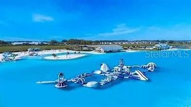 a view of a swimming pool with outdoor seating