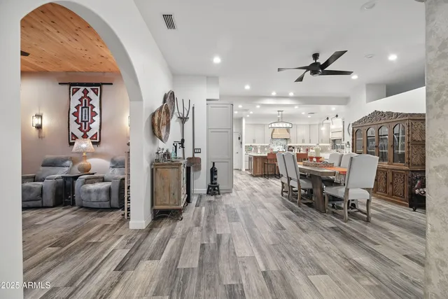 a bedroom with a large bed and a large window