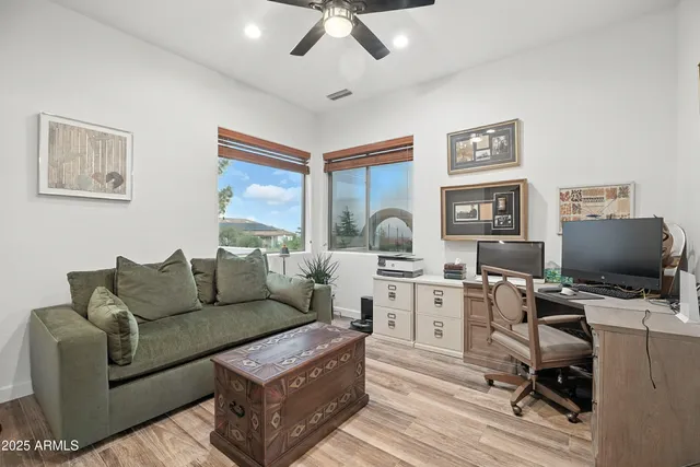 a bathroom with double vanity and a mirror