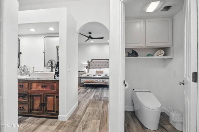 a view of storage and utility room with racks washing machine