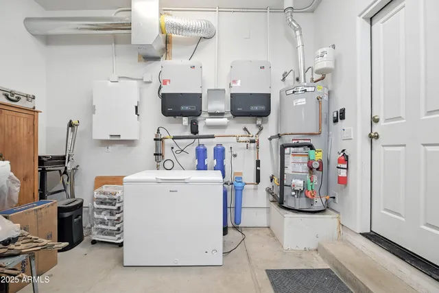 an aerial view of a house with a beach