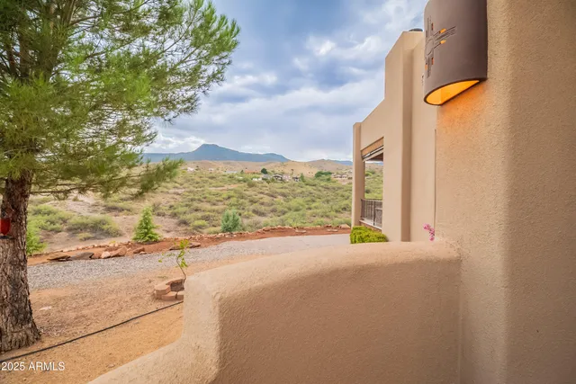 a view of a livingroom with furniture and mirror