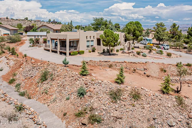 a building outdoor space with patio furniture and potted plants