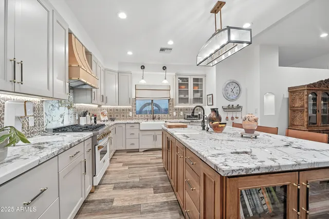 a dining room with furniture a rug and wooden floor
