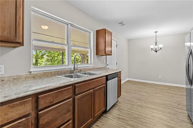 a kitchen with a sink and large window