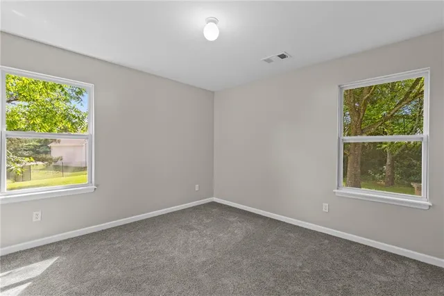 an empty room with closet area