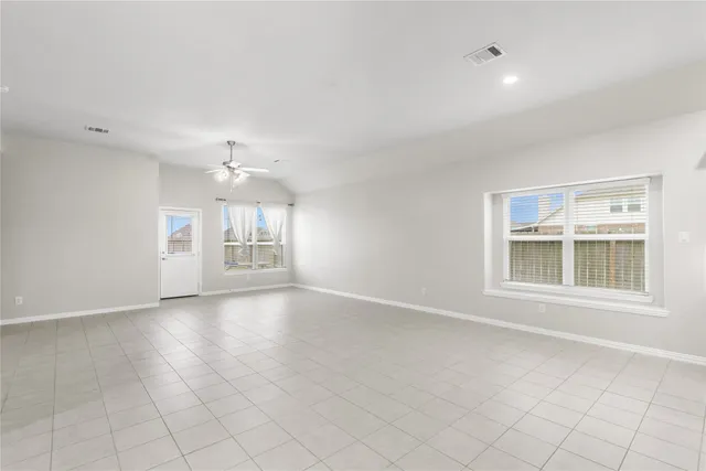 a view of kitchen with a sink and a refrigerator