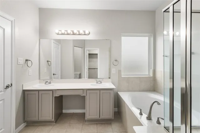 a bathroom with a bathtub and shower