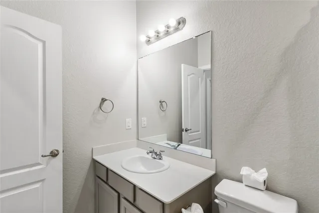 a view of an house with backyard space and a lake view