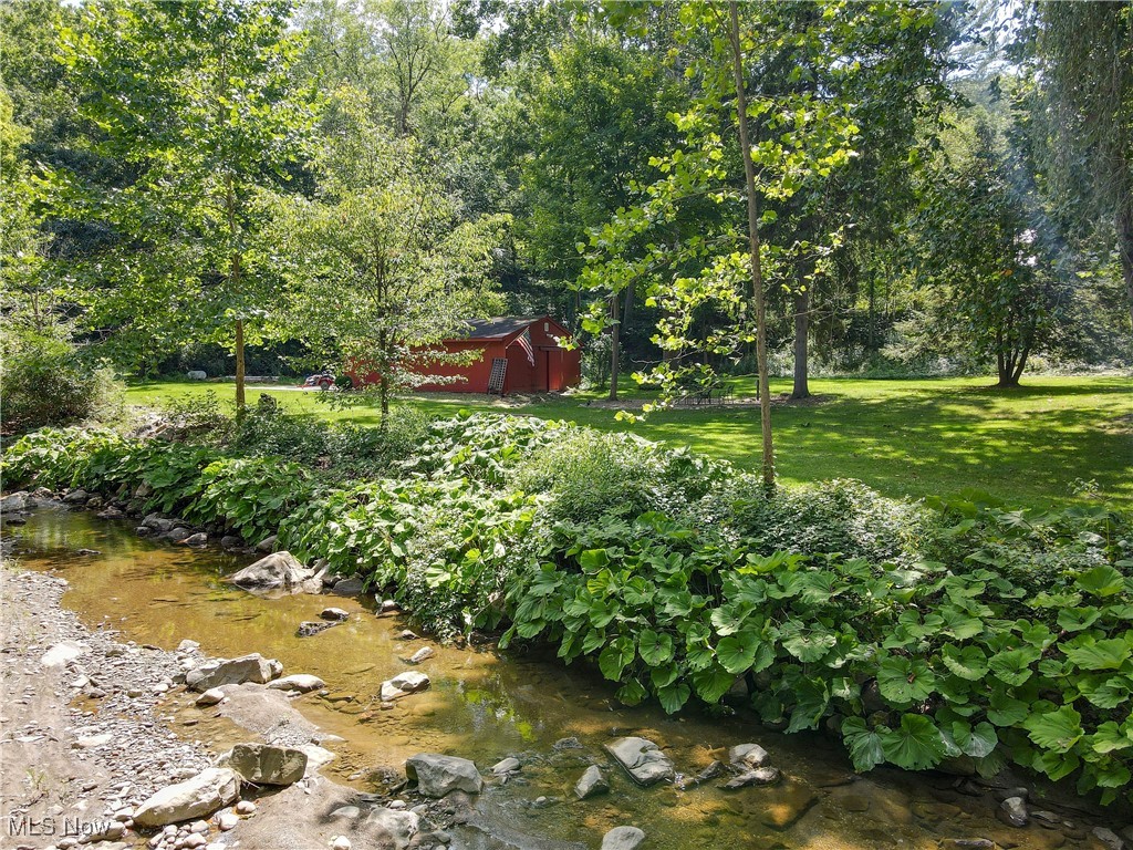 44001 Falls Road Hunting Valley, OH 44022 - Photo 39 of 43 Stand in the creek to take in a view of the barn and yard.