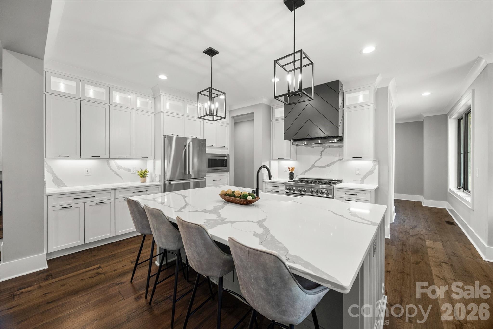 5438 Ralph Harper Lane Clover, SC 29710 - Photo 11 of 28 a kitchen with kitchen island a dining table and chairs