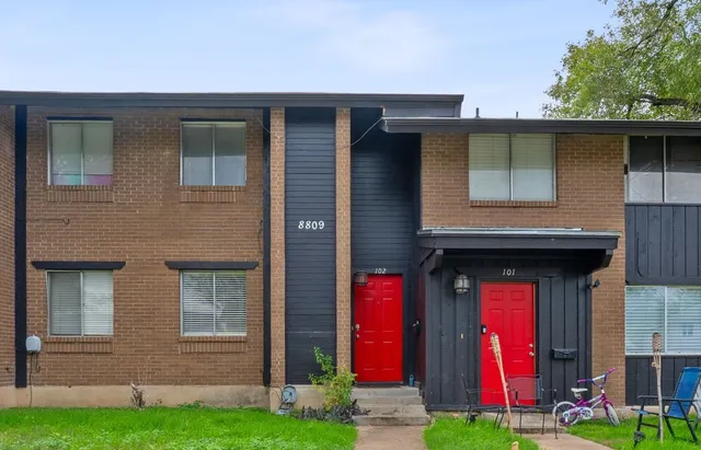 a front view of a house with yard