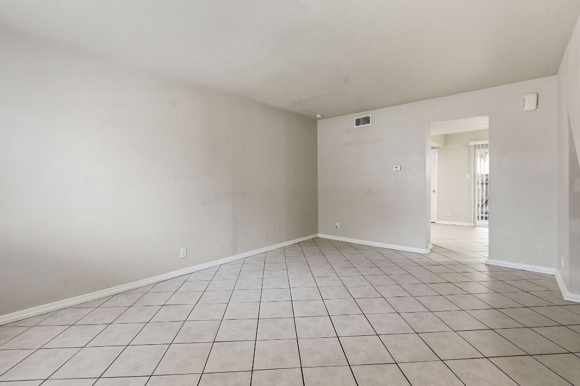 8809 Dawnridge Circle, Unit 102 Austin, TX 78757 - Photo 4 of 18 a view of an empty room