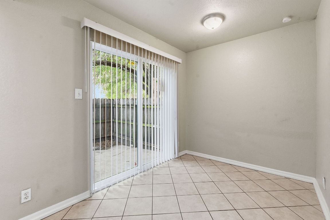 8809 Dawnridge Circle, Unit 102 Austin, TX 78757 - Photo 7 of 18 a view of an empty room and window