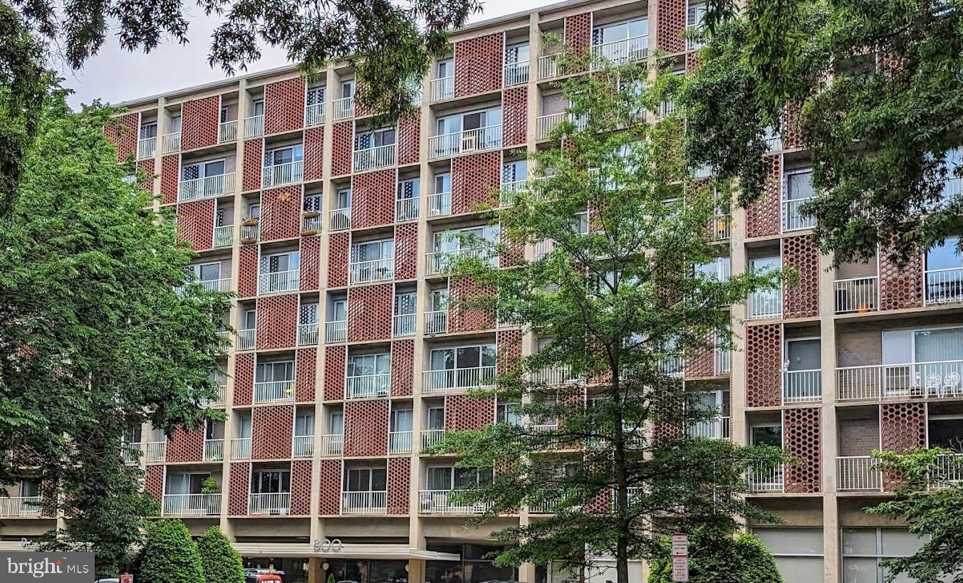 800 4th Street Southwest, Unit S824 Washington, DC 20024 - Photo 1 of 1 a front view of a multi story building with a yard