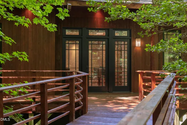 a view of outdoor space with wooden floor
