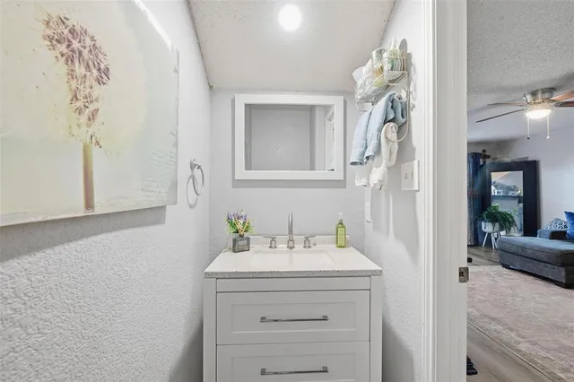 a bedroom with a bed and a flat tv screen