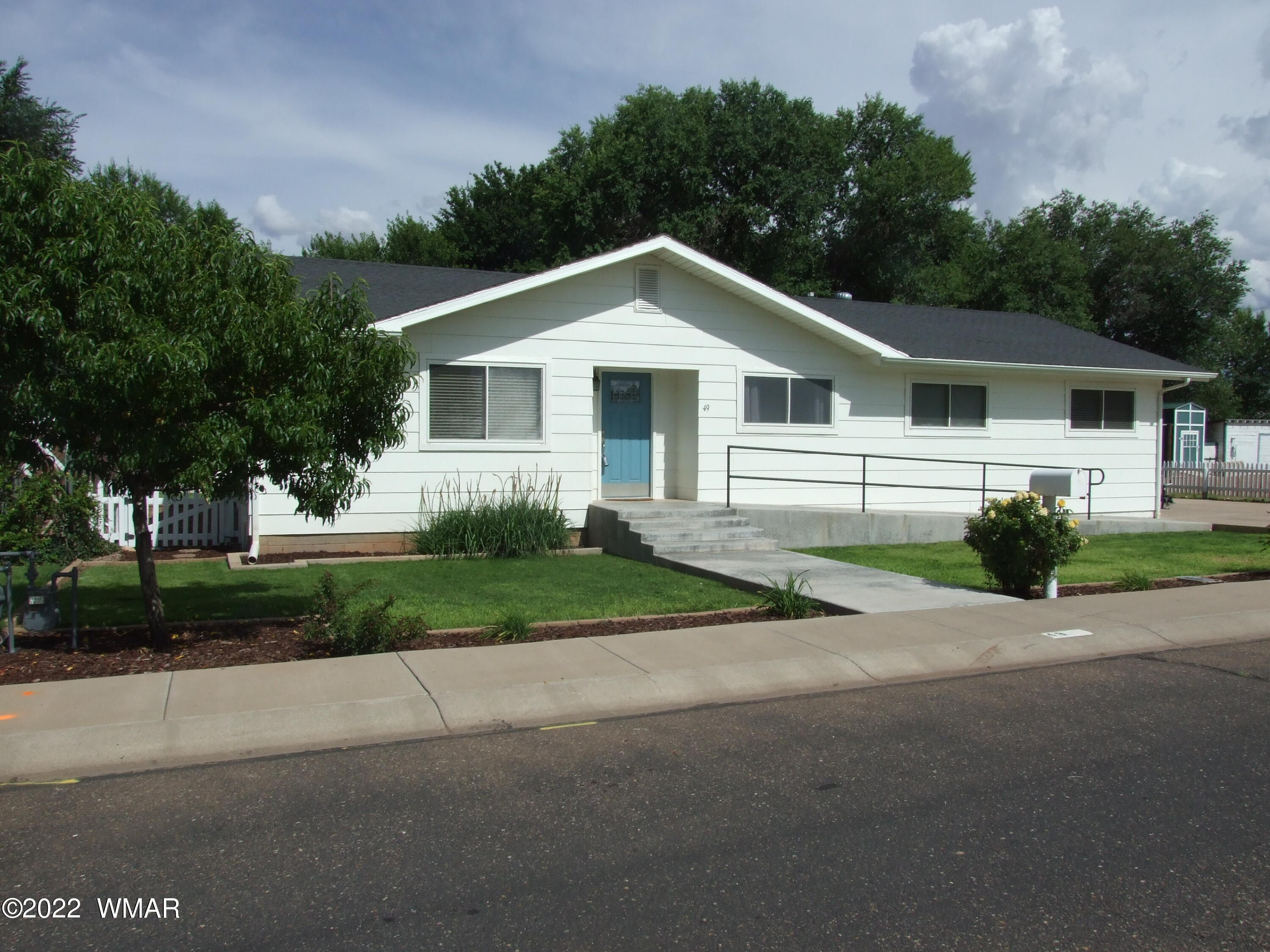 49 North 4th W Street Snowflake, AZ 85937 - Photo 1 of 34 a view of a house with a yard and large trees