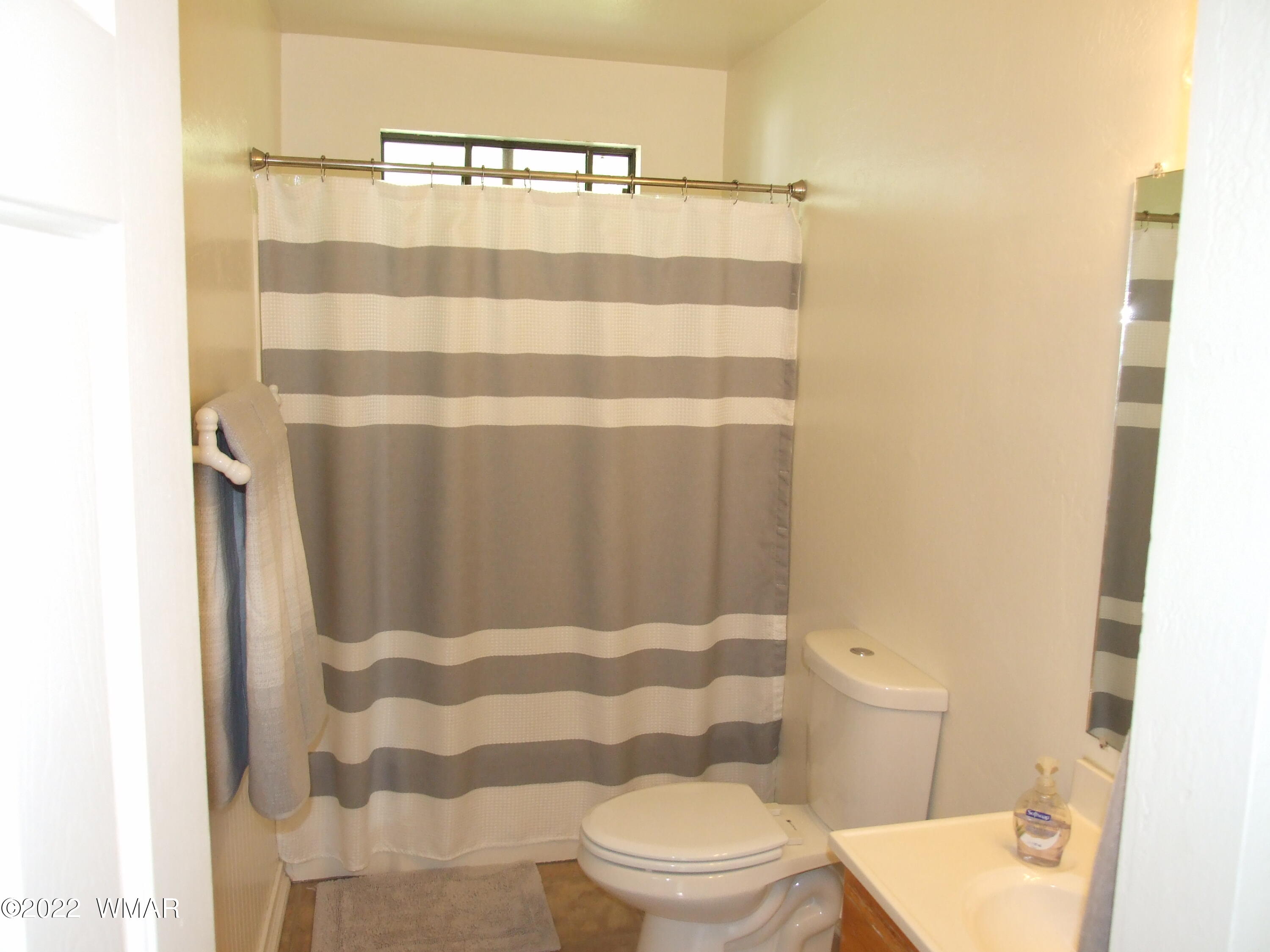 49 North 4th W Street Snowflake, AZ 85937 - Photo 26 of 34 a bathroom with a toilet and a shower curtain