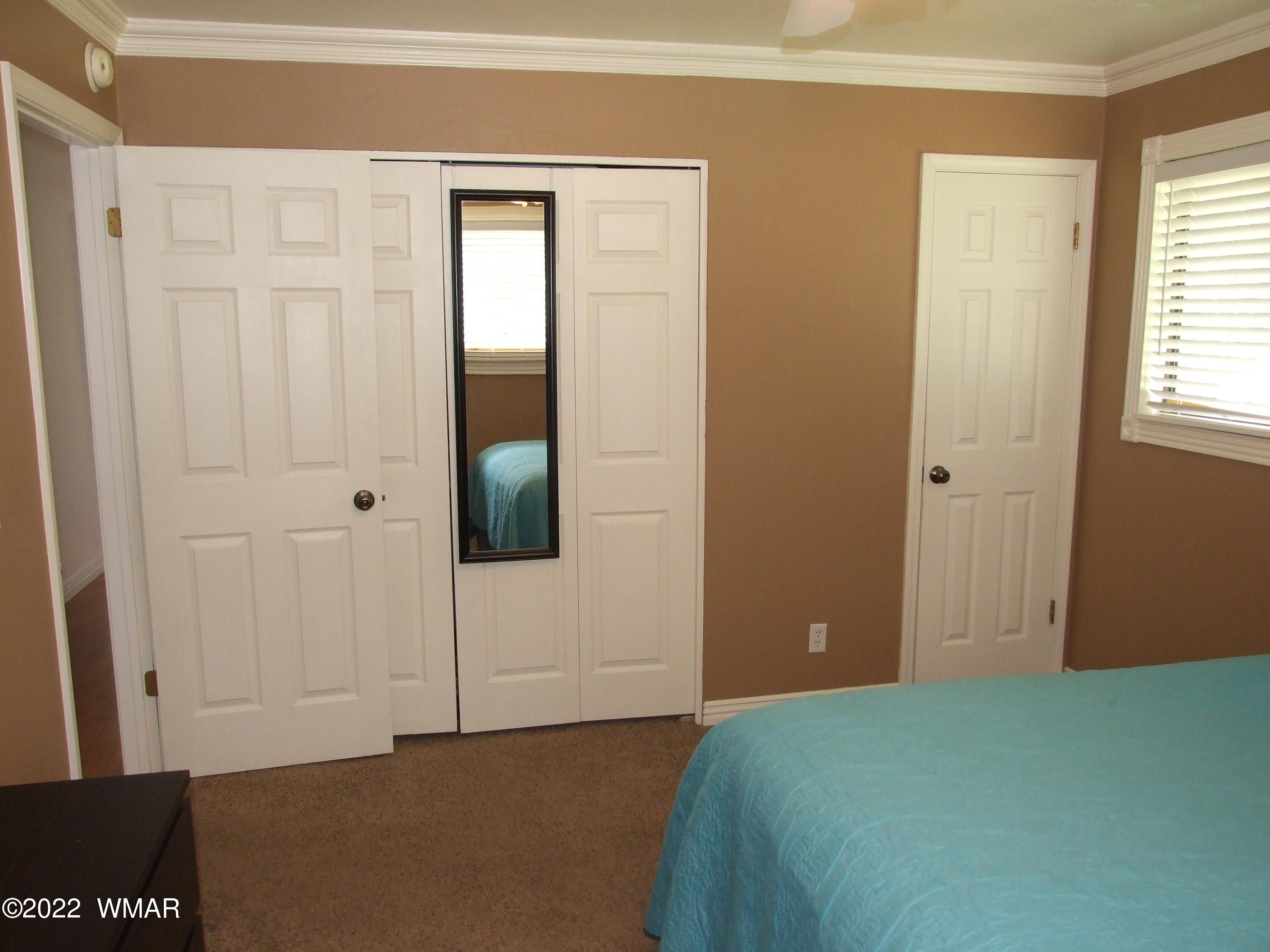 49 North 4th W Street Snowflake, AZ 85937 - Photo 31 of 34 a bedroom with a bed and a window