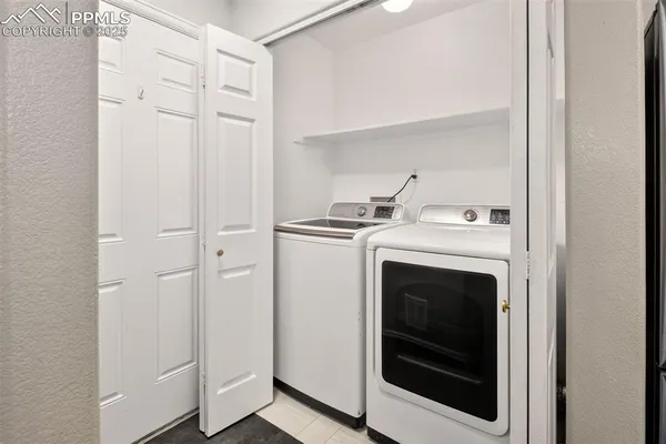 a view of washer and dryer in a utility room