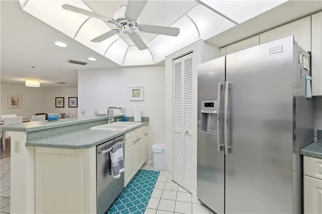 a bathroom with a granite countertop sink a mirror and a shower