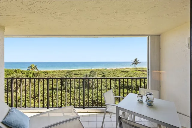 a view of a balcony with an ocean view