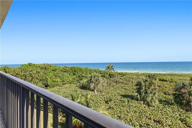 a bathroom with a shower sink and mirror