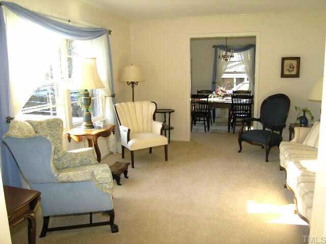 1105 Ralph Drive Cary, NC 27511 - Photo 3 of 12 a living room with furniture and a fireplace