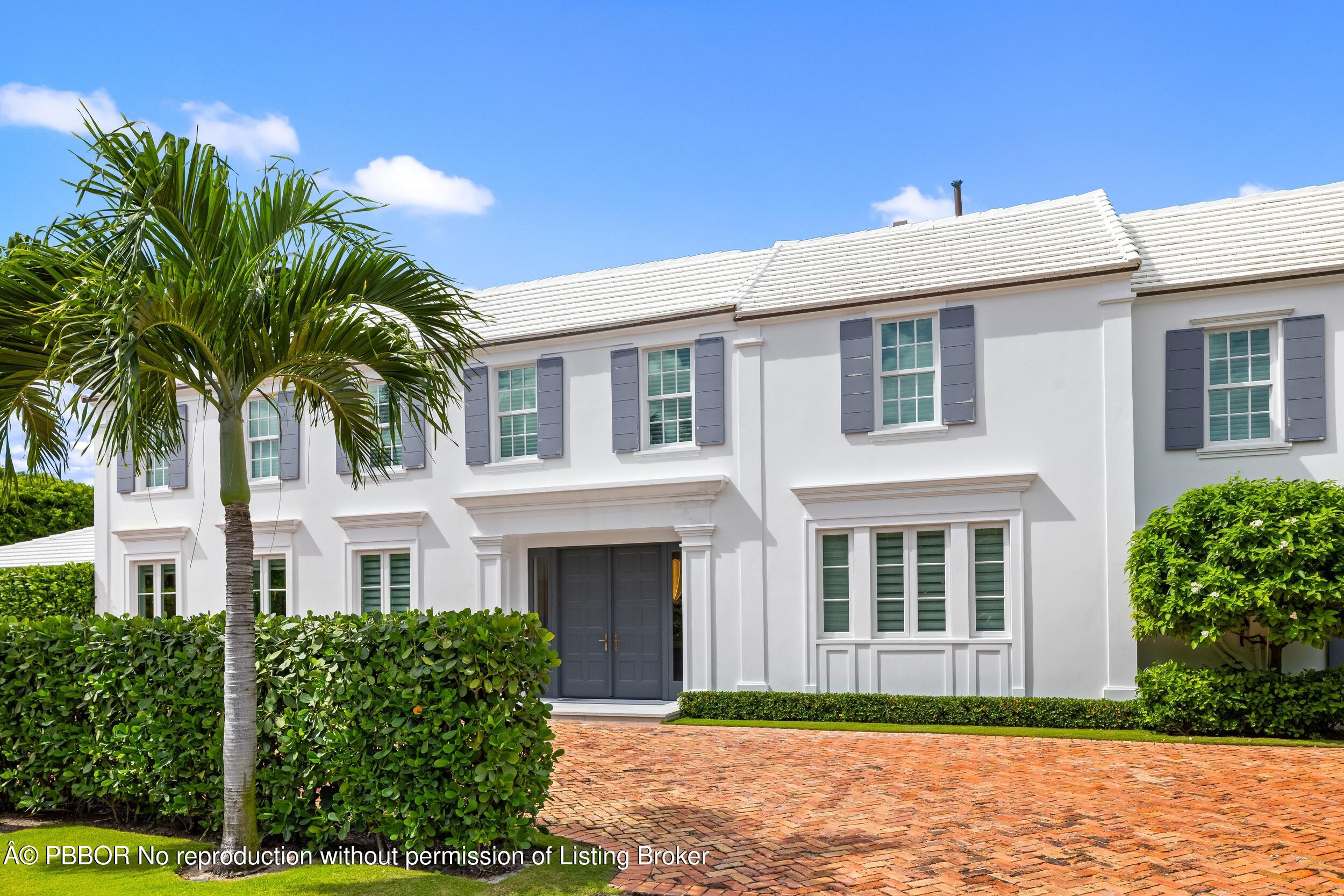 201 Banyan Road Palm Beach, FL 33480 - Photo 41 of 42 a front view of a house with a garden