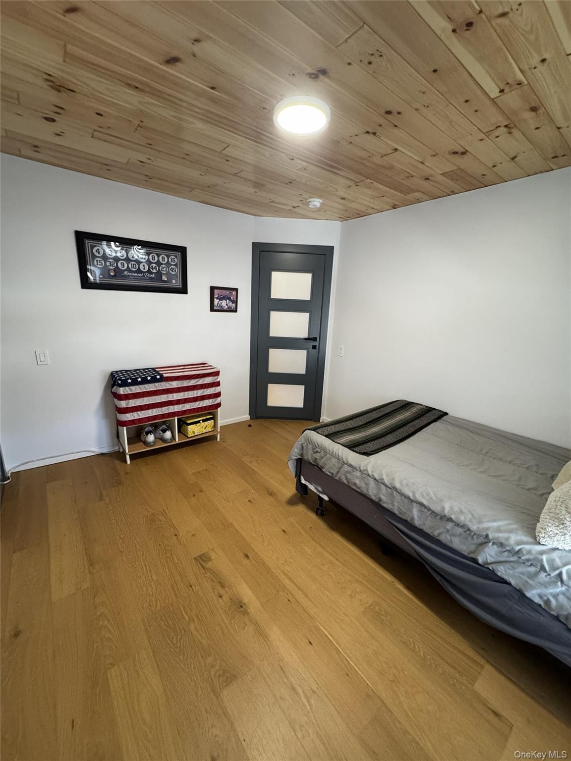 241 Main Street Cold Spring, NY 10516 - Photo 16 of 29 a bedroom with a bed and a dresser