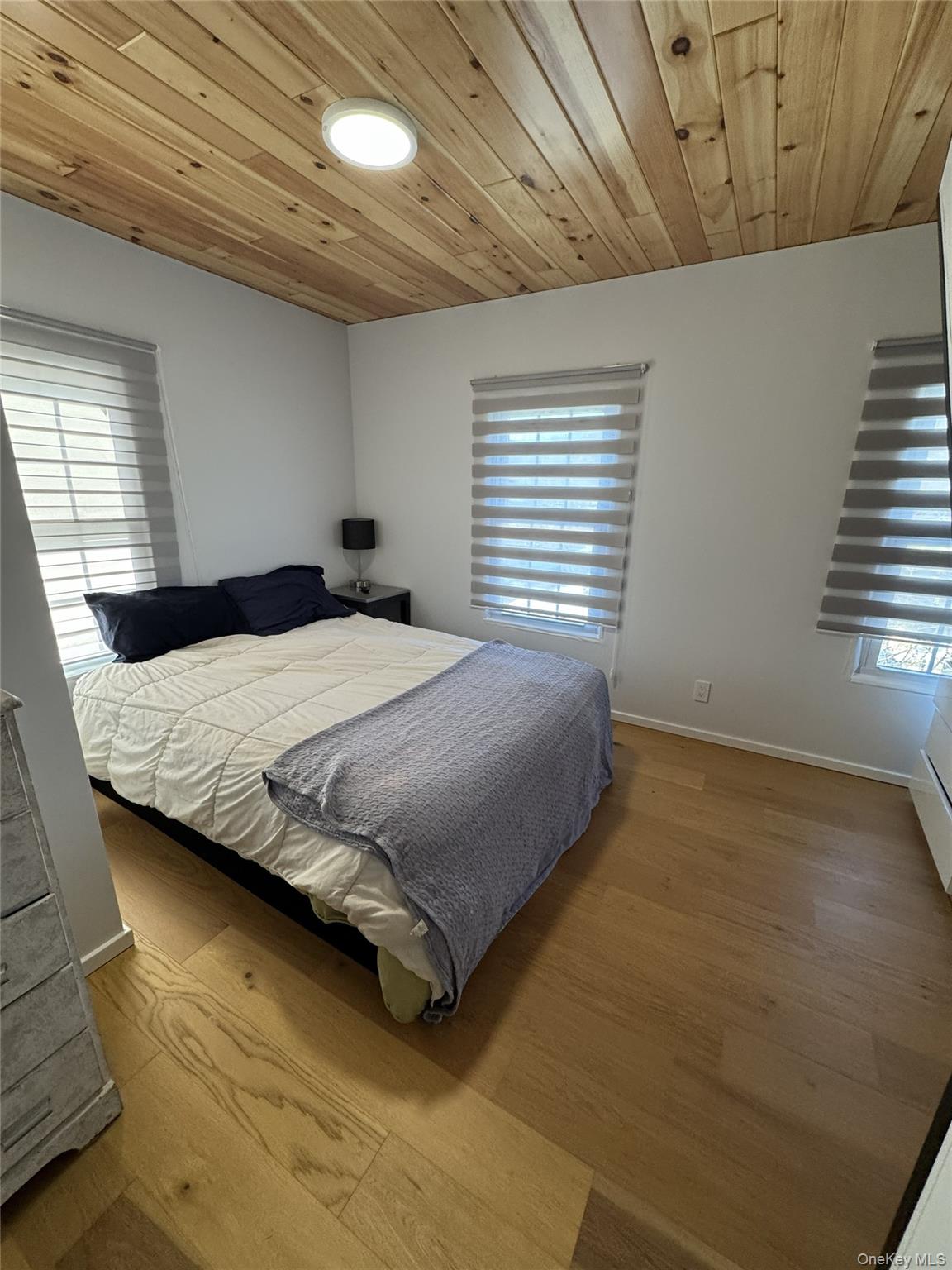 241 Main Street Cold Spring, NY 10516 - Photo 17 of 29 a bedroom with a bed and a window