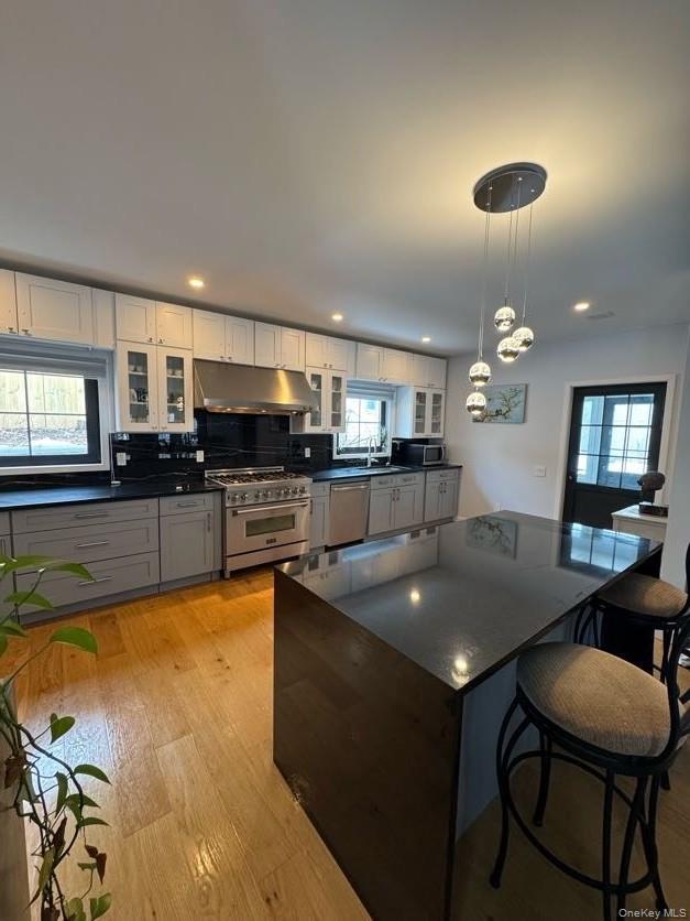 241 Main Street Cold Spring, NY 10516 - Photo 2 of 29 a kitchen with a table chairs and microwave