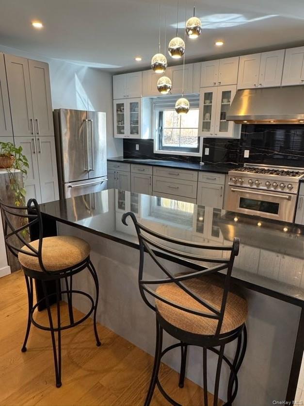 241 Main Street Cold Spring, NY 10516 - Photo 3 of 29 a kitchen with stainless steel appliances kitchen island granite countertop a stove a sink and a refrigerator