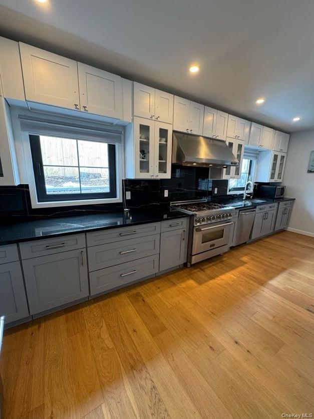 241 Main Street Cold Spring, NY 10516 - Photo 4 of 29 a kitchen with stainless steel appliances granite countertop a stove a sink and a microwave