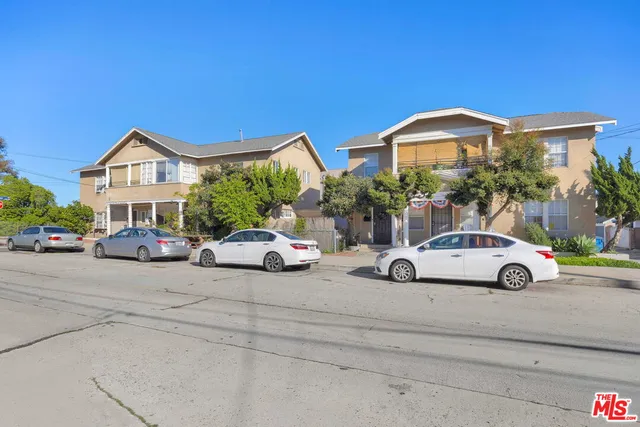 a view of a car parked in front of a house