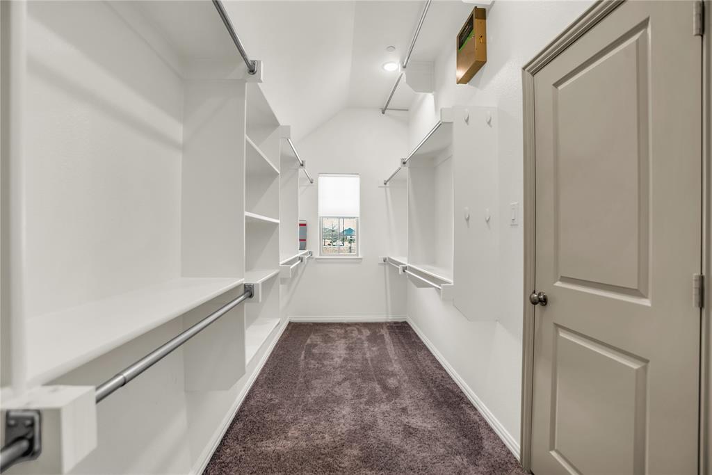 999 Emil Place Allen, TX 75013 - Photo 14 of 29 a view of a hallway with a white walls