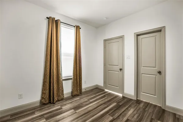 a bathroom with a sink a toilet a mirror and shower
