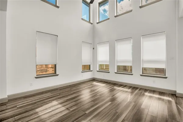 a view of an empty room with windows