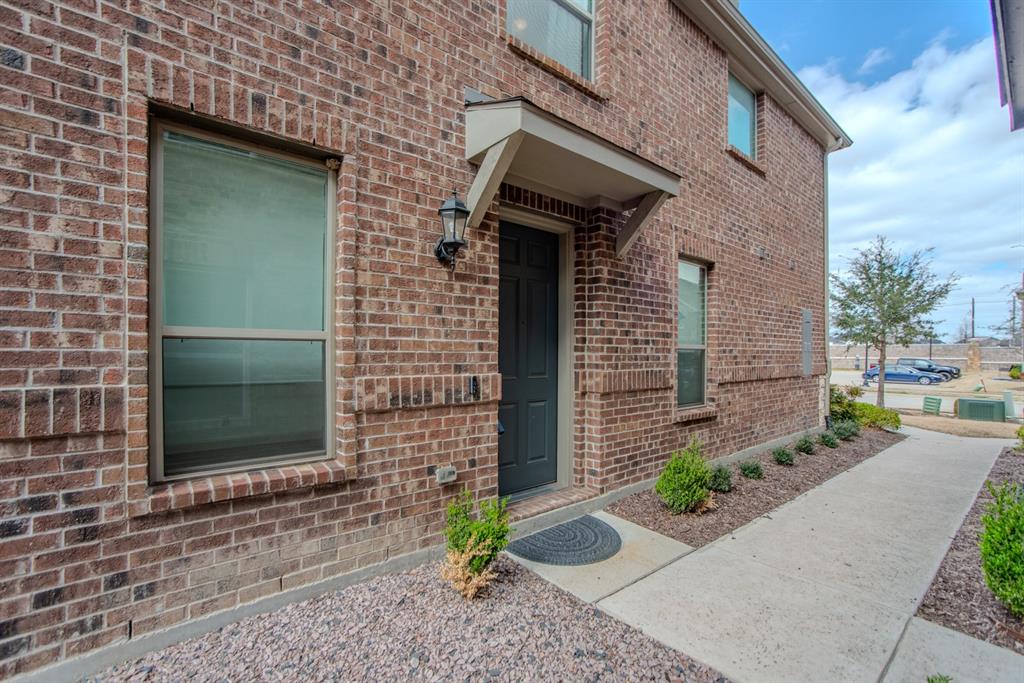 999 Emil Place Allen, TX 75013 - Photo 23 of 29 a front view of a house with a garden