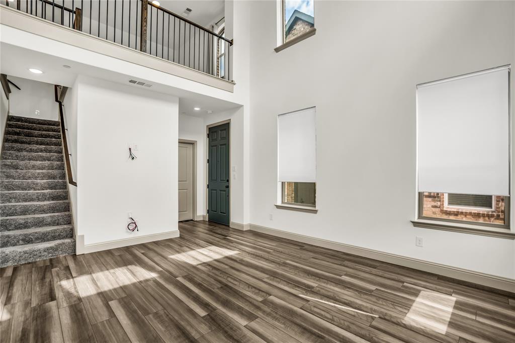 999 Emil Place Allen, TX 75013 - Photo 4 of 29 a view of a bedroom with wooden floor