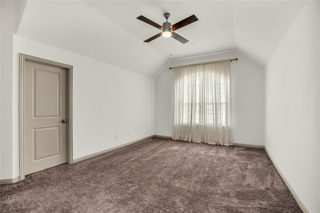999 Emil Place Allen, TX 75013 - Photo 10 of 29 wooden floor in an empty room with a window