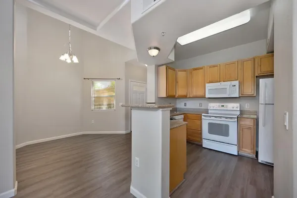 a kitchen that has a sink and a stove