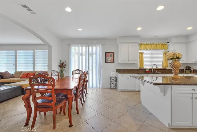 a view of a dining room with furniture and window