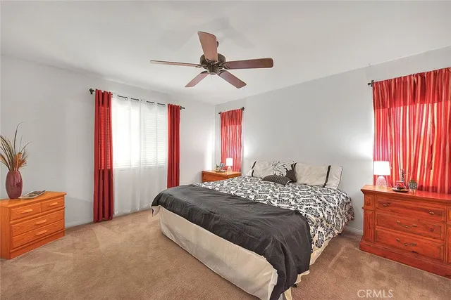 a bedroom with a bed and window