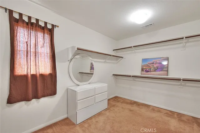 a view of a livingroom with furniture and a window