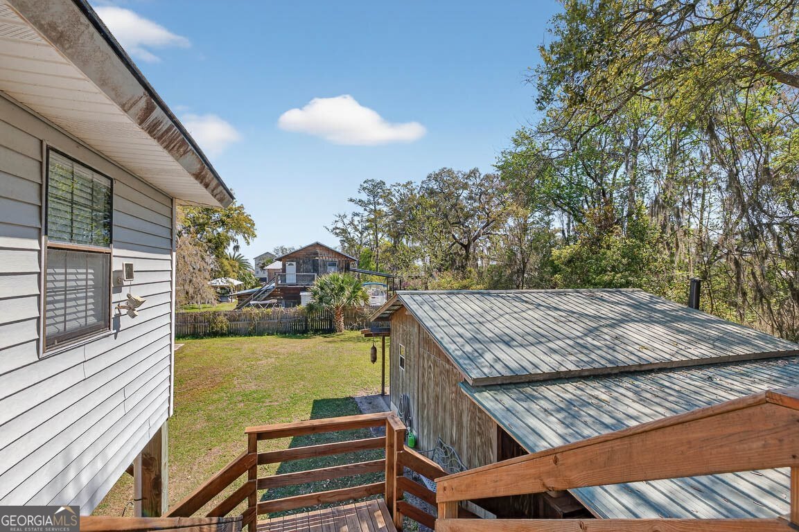 33 Warren Avenue Waverly, GA 31565 - Photo 21 of 63 a view of an outdoor kitchen and swimming pool