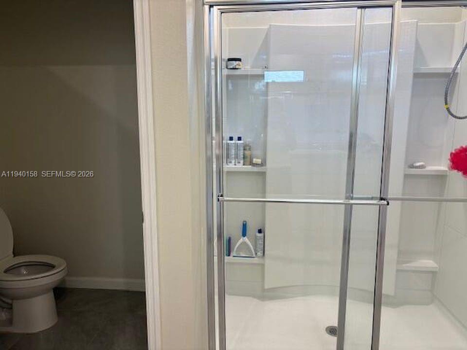 571 Old Country Rd S East Palm Bay, FL 32909 - Photo 15 of 29 a bathroom with a toilet and a shower