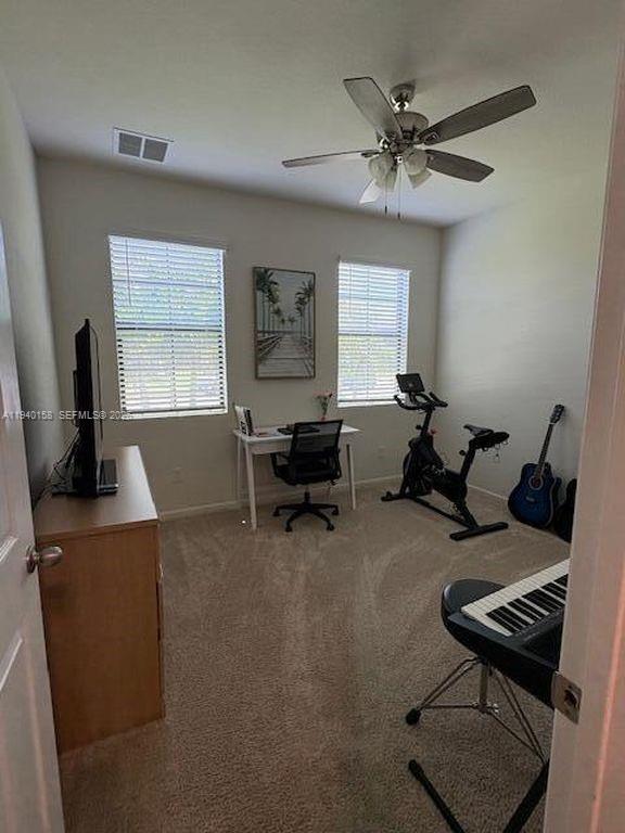 571 Old Country Rd S East Palm Bay, FL 32909 - Photo 16 of 29 a living room with furniture and a window